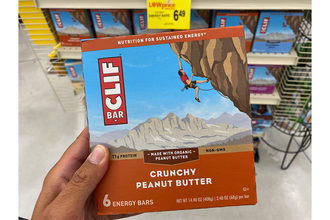 A person holding a Clif Bar box