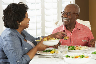 Senior couple eating dinner